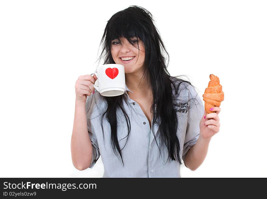 Cute girl with cup and croissant in shirt isolated on white