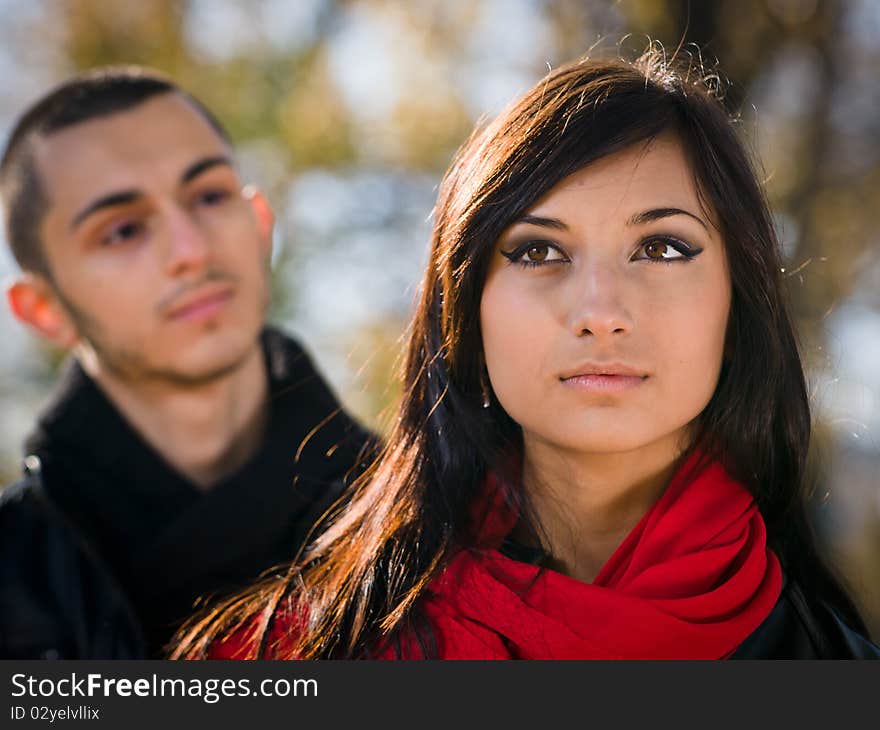 Beauty girl and young guy at back