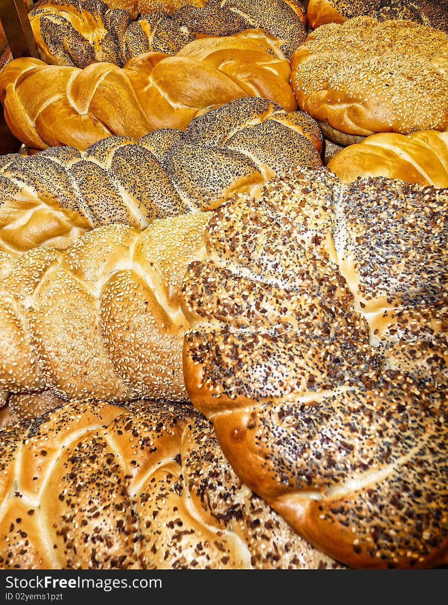 Assortment of fresh baked bread out of the oven in the bakery. Assortment of fresh baked bread out of the oven in the bakery