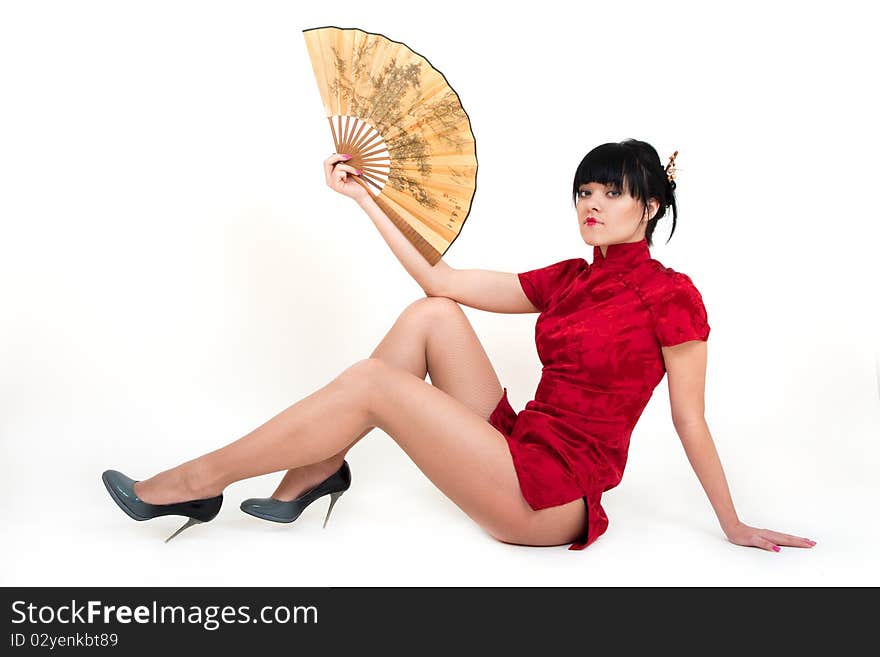 Portrait of girl in geisha with fan costume isolated on white