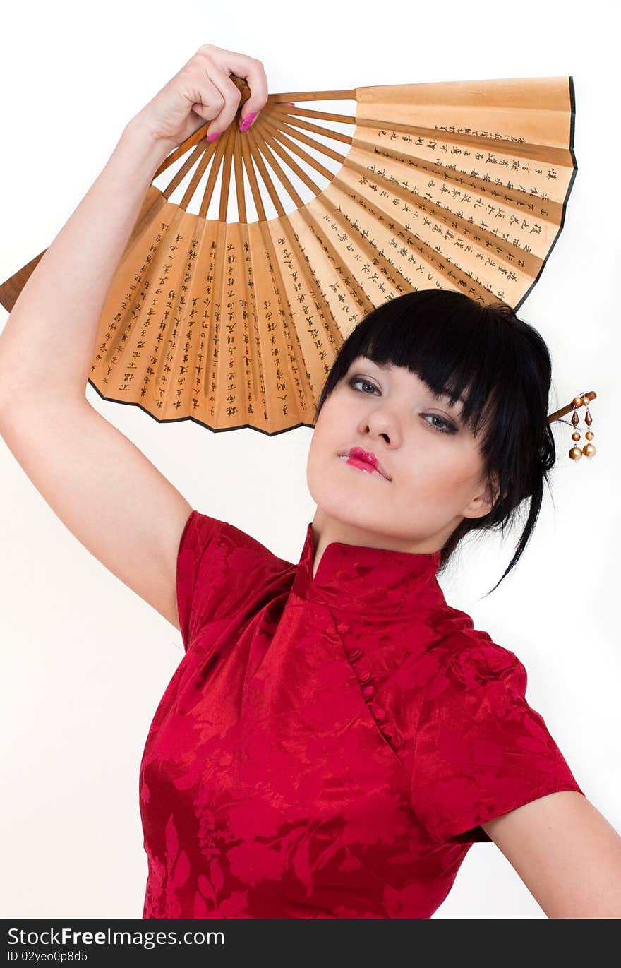 Portrait of girl in geisha costume isolated on white