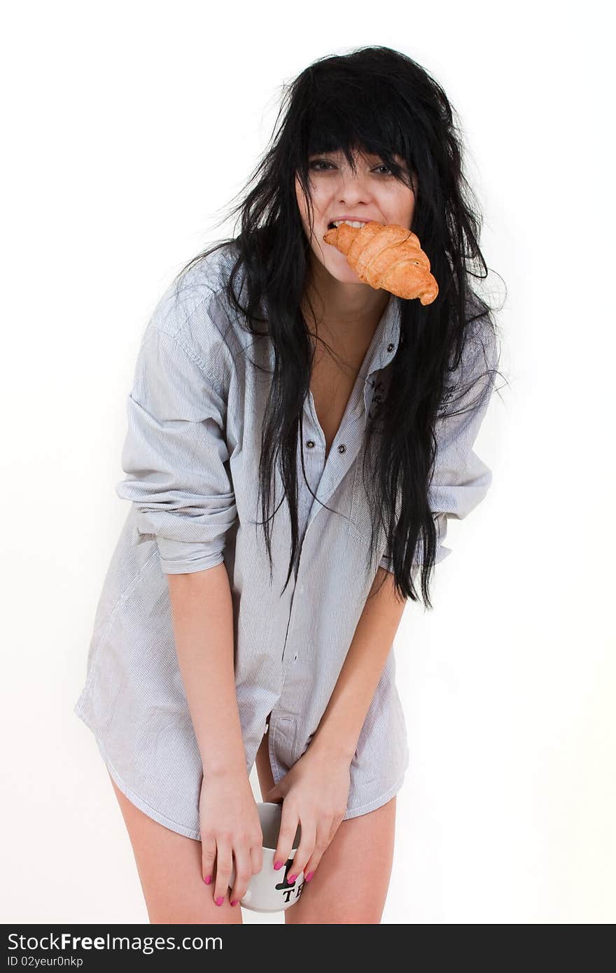 Cute girl with cup and croissant in shirt isolated on white