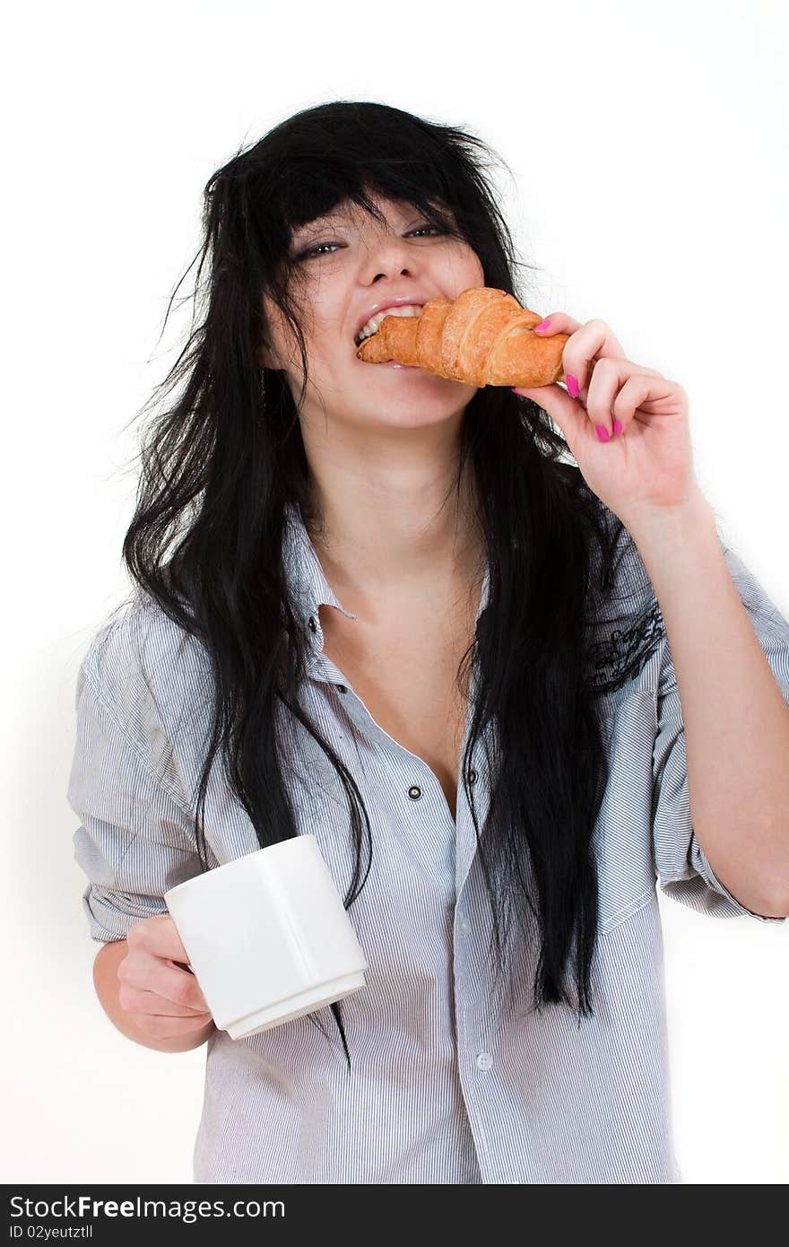 Cute girl with cup and croissant in shirt isolated on white