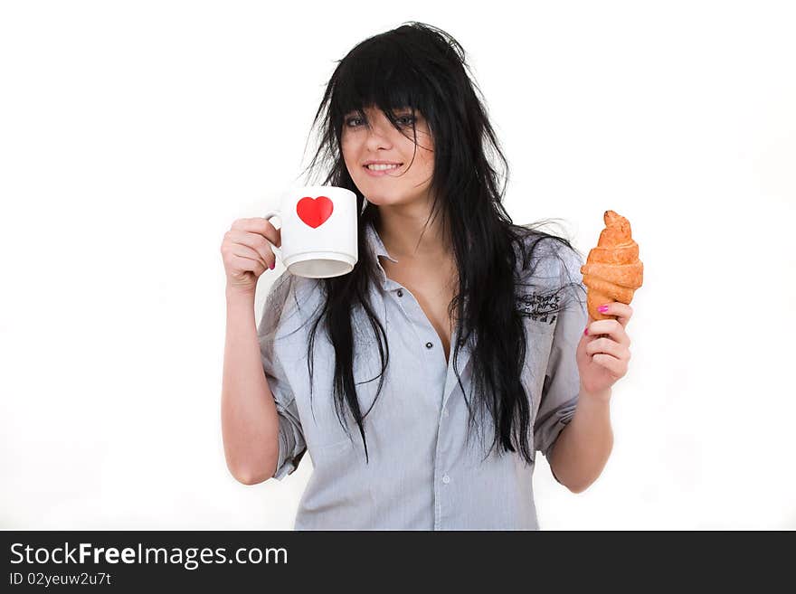 Cute girl with cup and croissant in shirt isolated on white