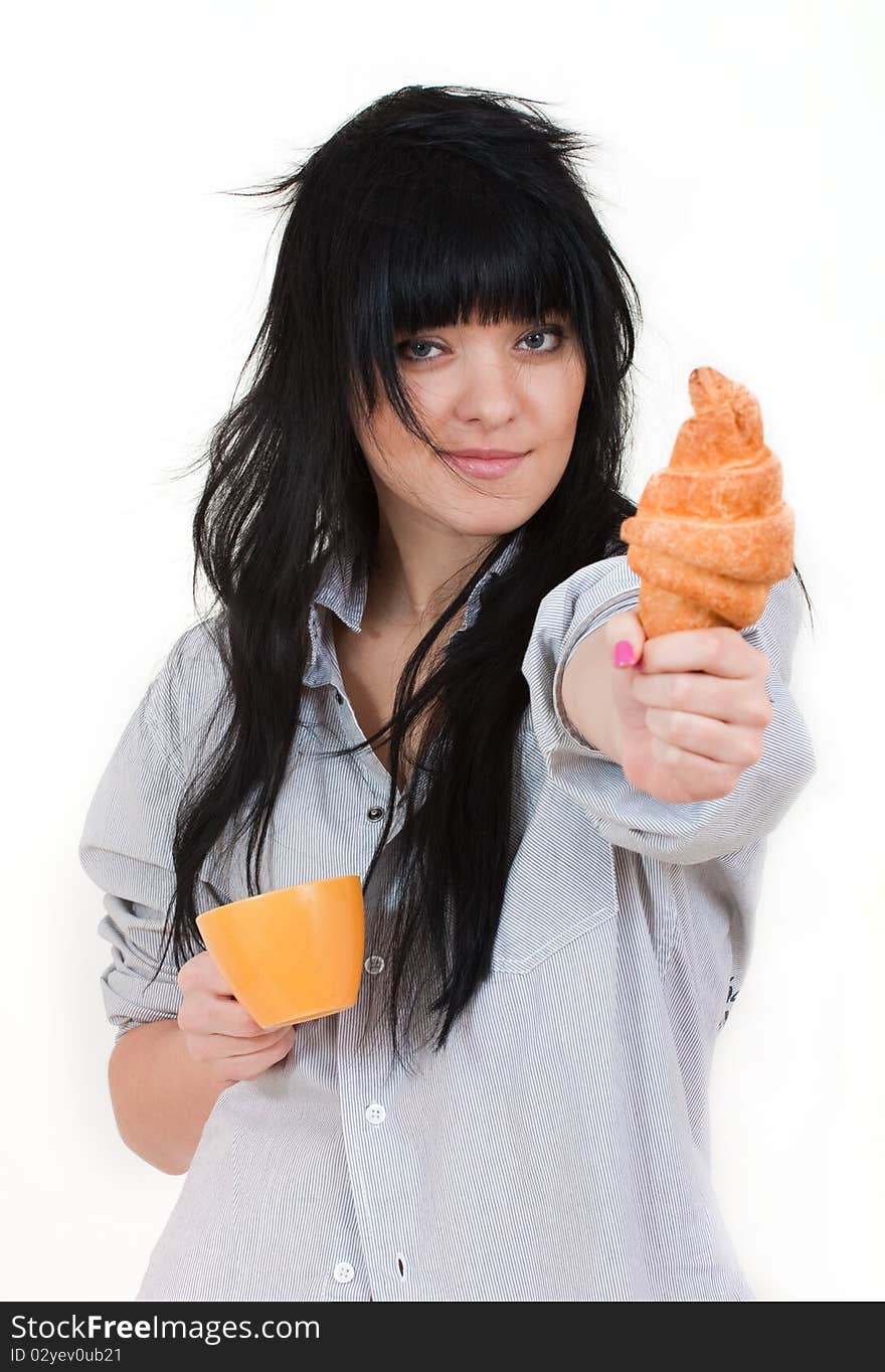 Cute girl with cup and croissant in shirt isolated on white