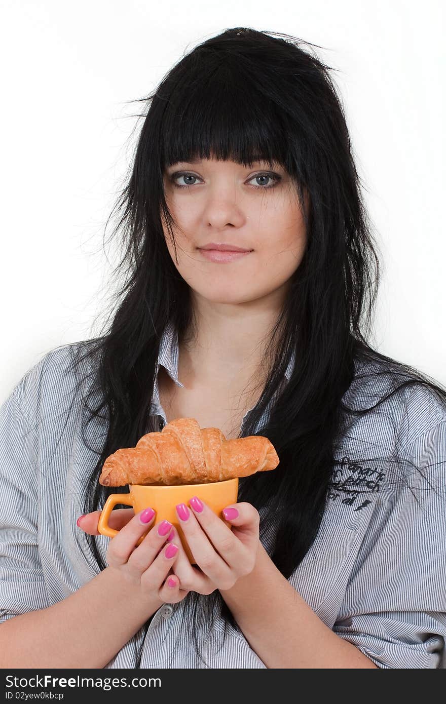 Cute girl with cup and croissant in shirt isolated on white