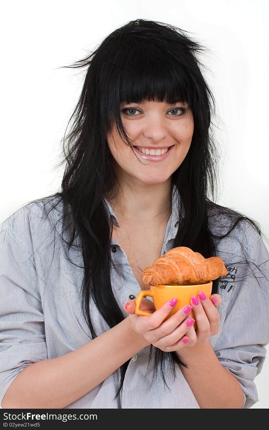 Cute girl with cup and croissant in shirt isolated on white