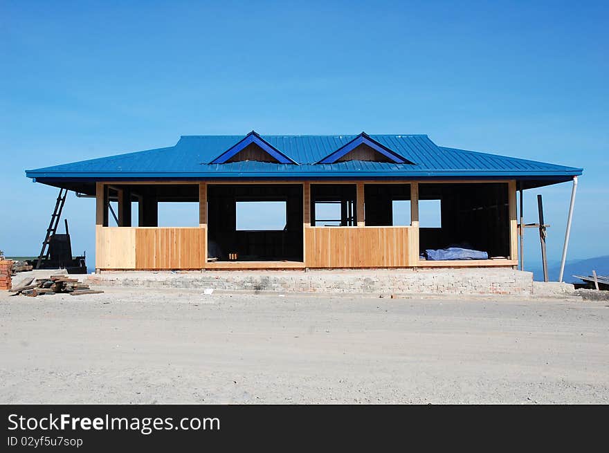 A house renovation with blue sky as background