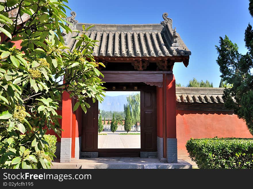 Door and court view of a Chinese old temple garden, shown as traditional architecture style and detail. Door and court view of a Chinese old temple garden, shown as traditional architecture style and detail.