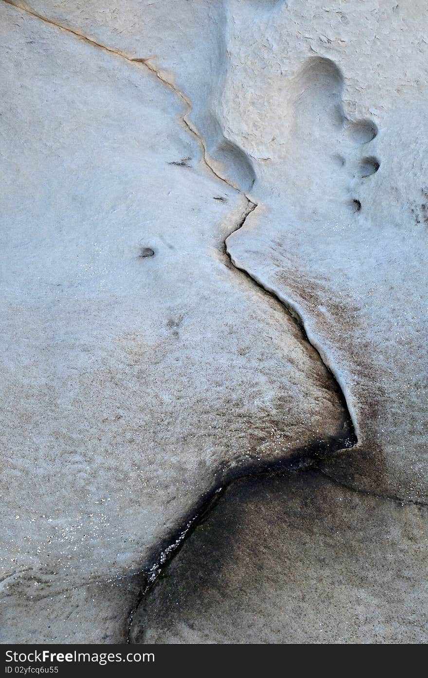 Abstract minimalistic texture of a single line crack on a large rock surface. Abstract minimalistic texture of a single line crack on a large rock surface