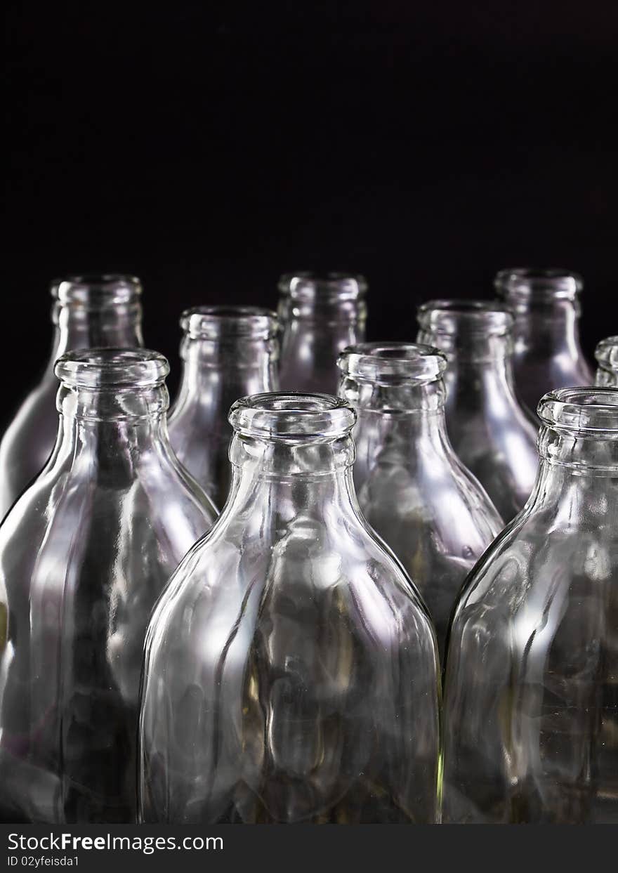 Empty bottles collection, colorless, isolated on black background