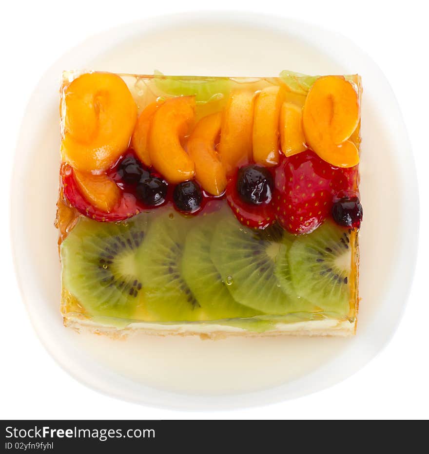 Close-up curd cake with jellied fruits and berries, isolated on white