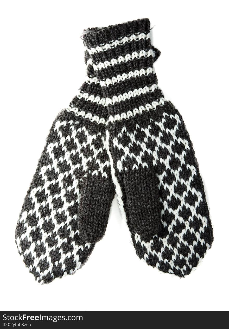 Knitted winter mittens with pattern on white background