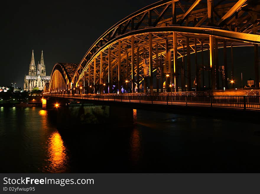 The famous Cologne (Germany) bridge from across the River Rhine at night. The famous Cologne (Germany) bridge from across the River Rhine at night