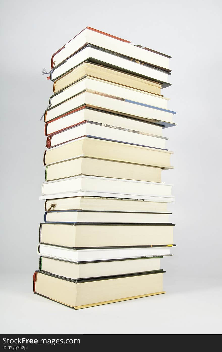 This image shows several books stacked and supported on the stack