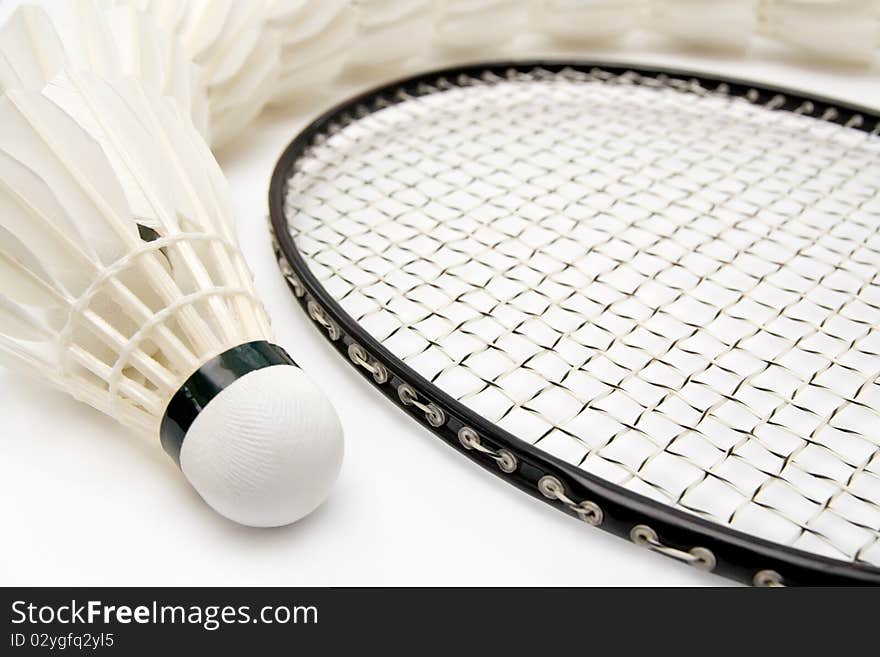 Row of shuttlecocks with badminton racket. Close-up. Row of shuttlecocks with badminton racket. Close-up