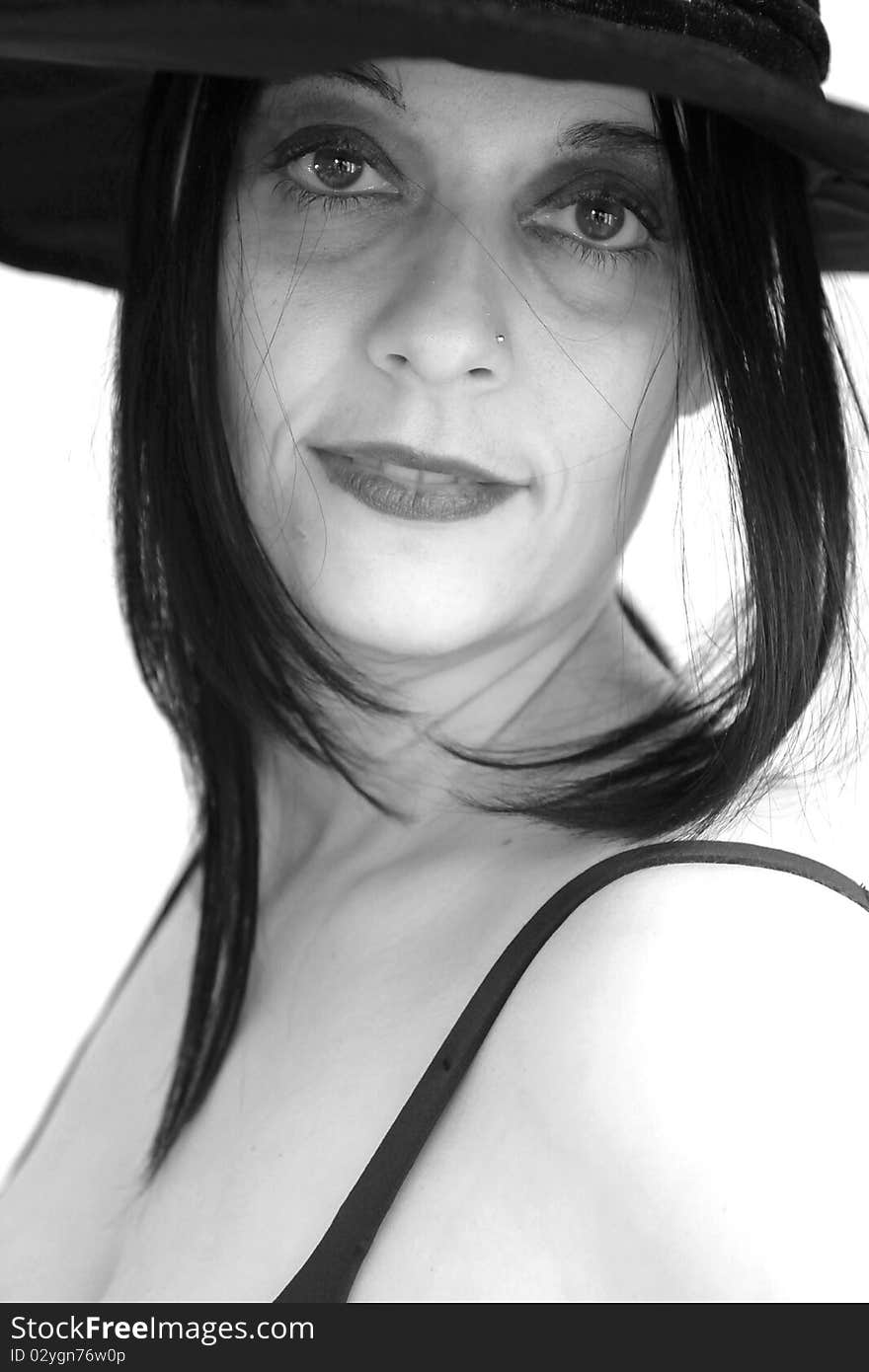 Brunette with hat and black makeup. Brunette with hat and black makeup