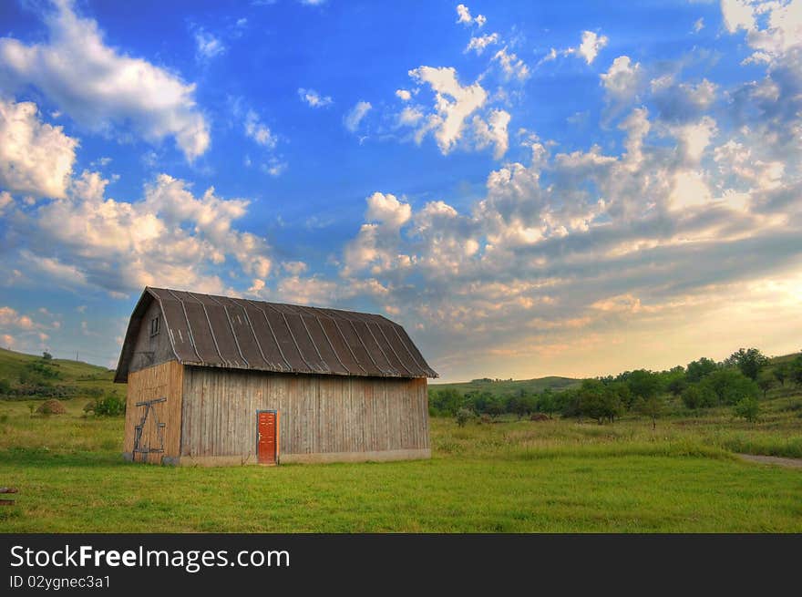 Autumn landscape with an isolated hut on sunset. Autumn landscape with an isolated hut on sunset