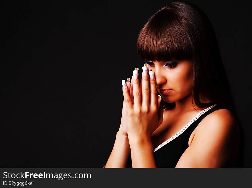 Modest attractive young woman in black dress