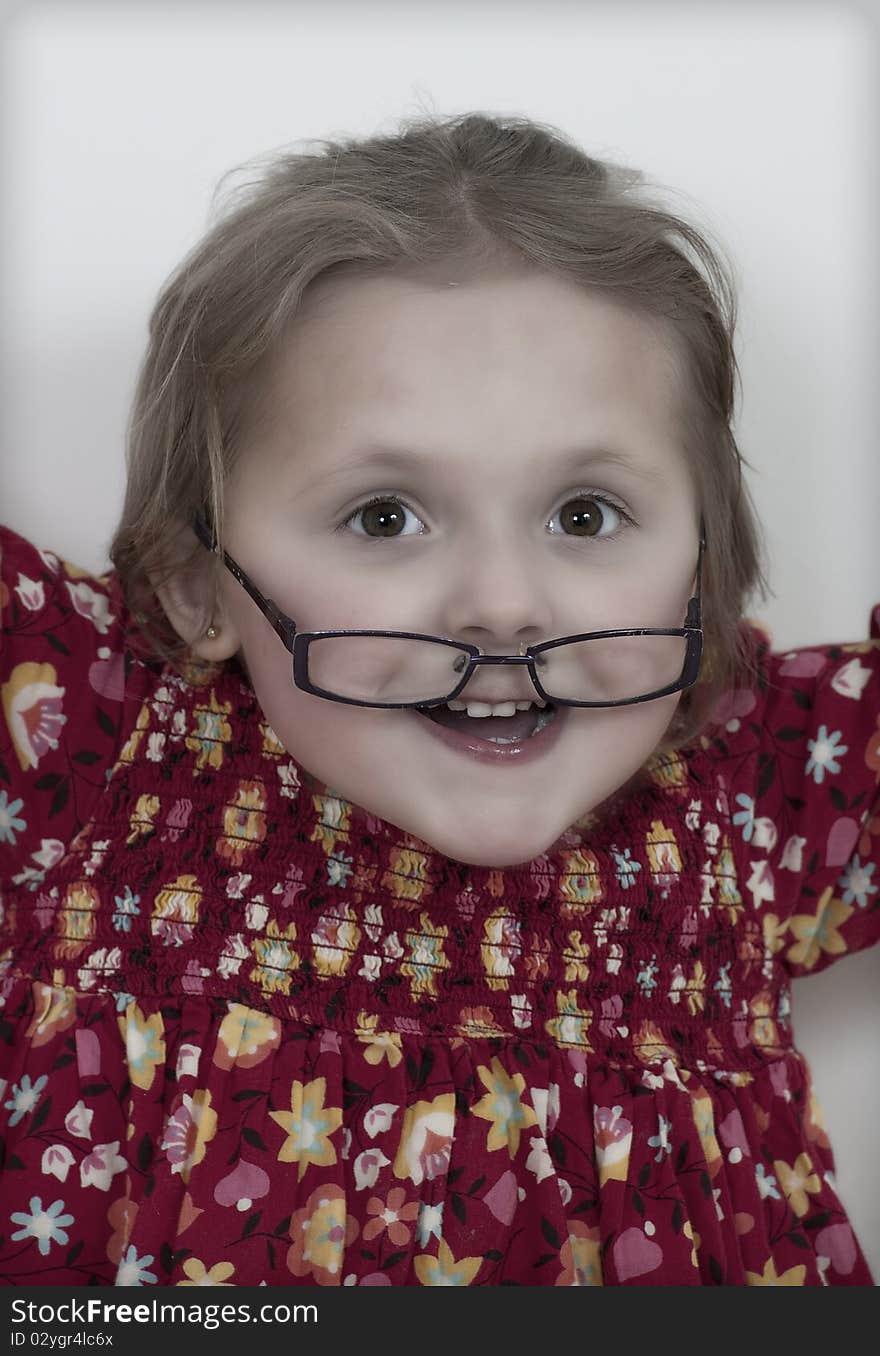 Portrait of a happy girl wearing glasses