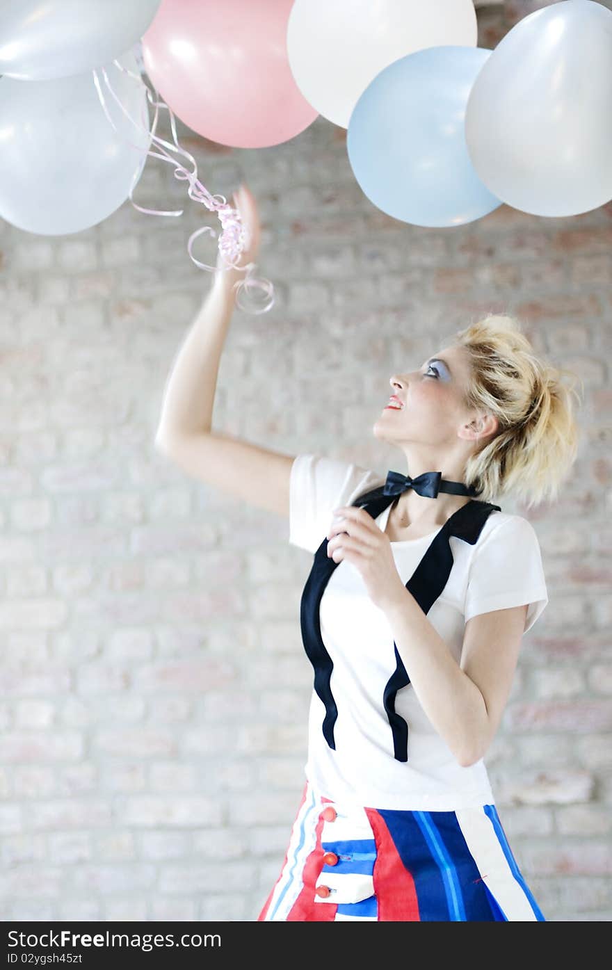 Attractive woman playing with balloons. Attractive woman playing with balloons