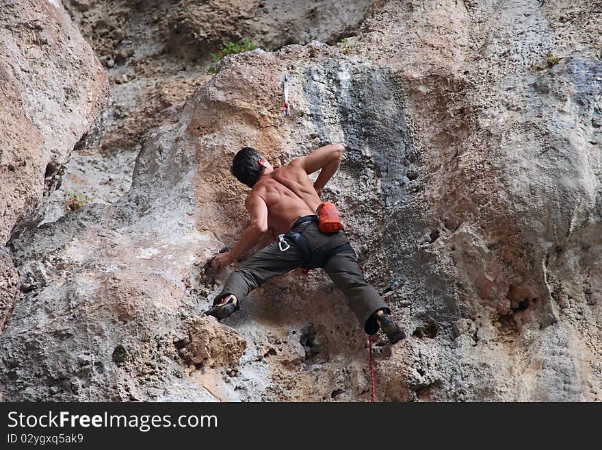 Rock Climber On Cliff