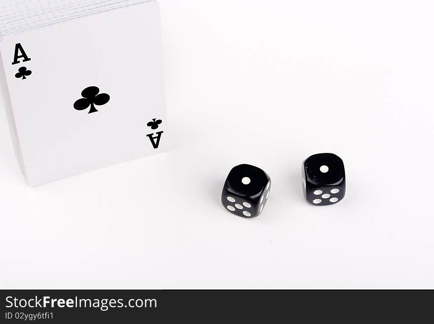 Subject excitement - on a white background a deck of cards and game cubes.