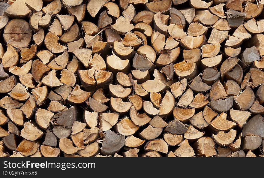 Stack of firewood background outdoors