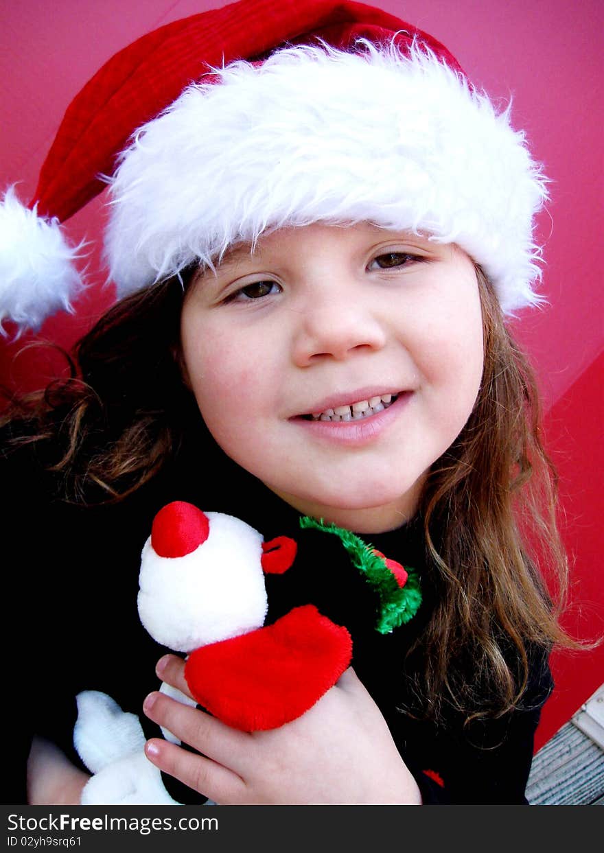 Happy christmas child wearing santa hat during holiday season