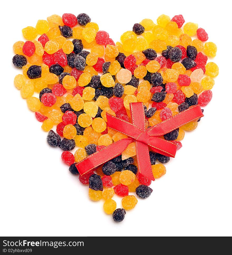 Beautiful sweet candies in heart shape isolated on a white background.