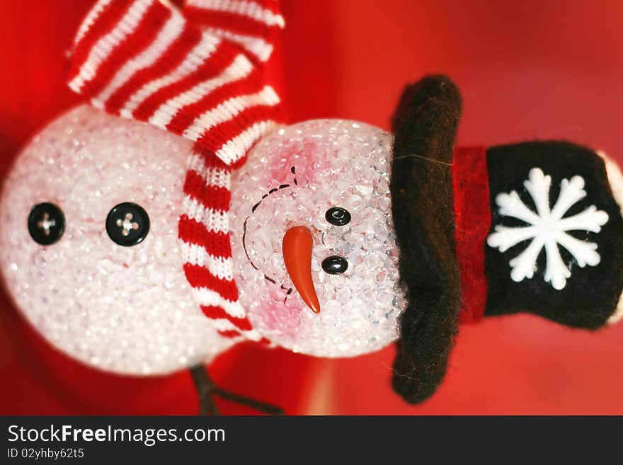 Snowman with black hat on red background decoration. Snowman with black hat on red background decoration