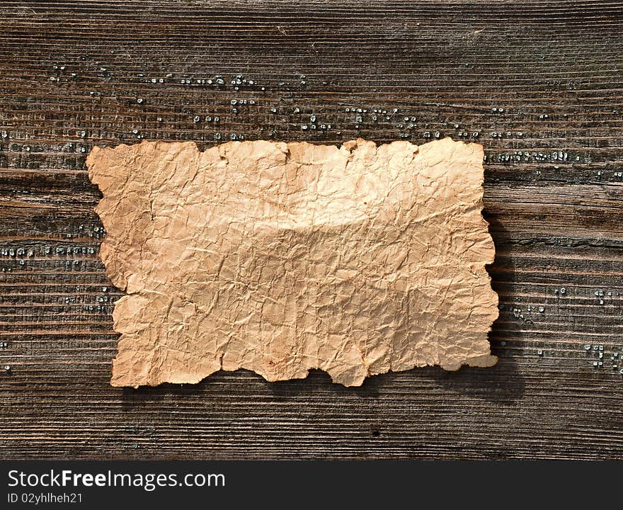 Old paper over an old wood background. Old paper over an old wood background