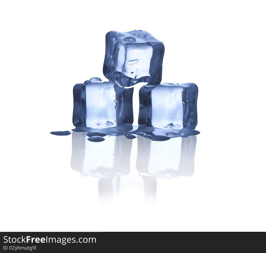 Melting ice cubes on glass table.