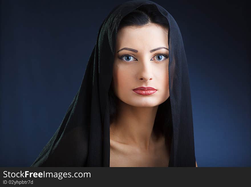 Portrait of elegant beautiful woman in shawl