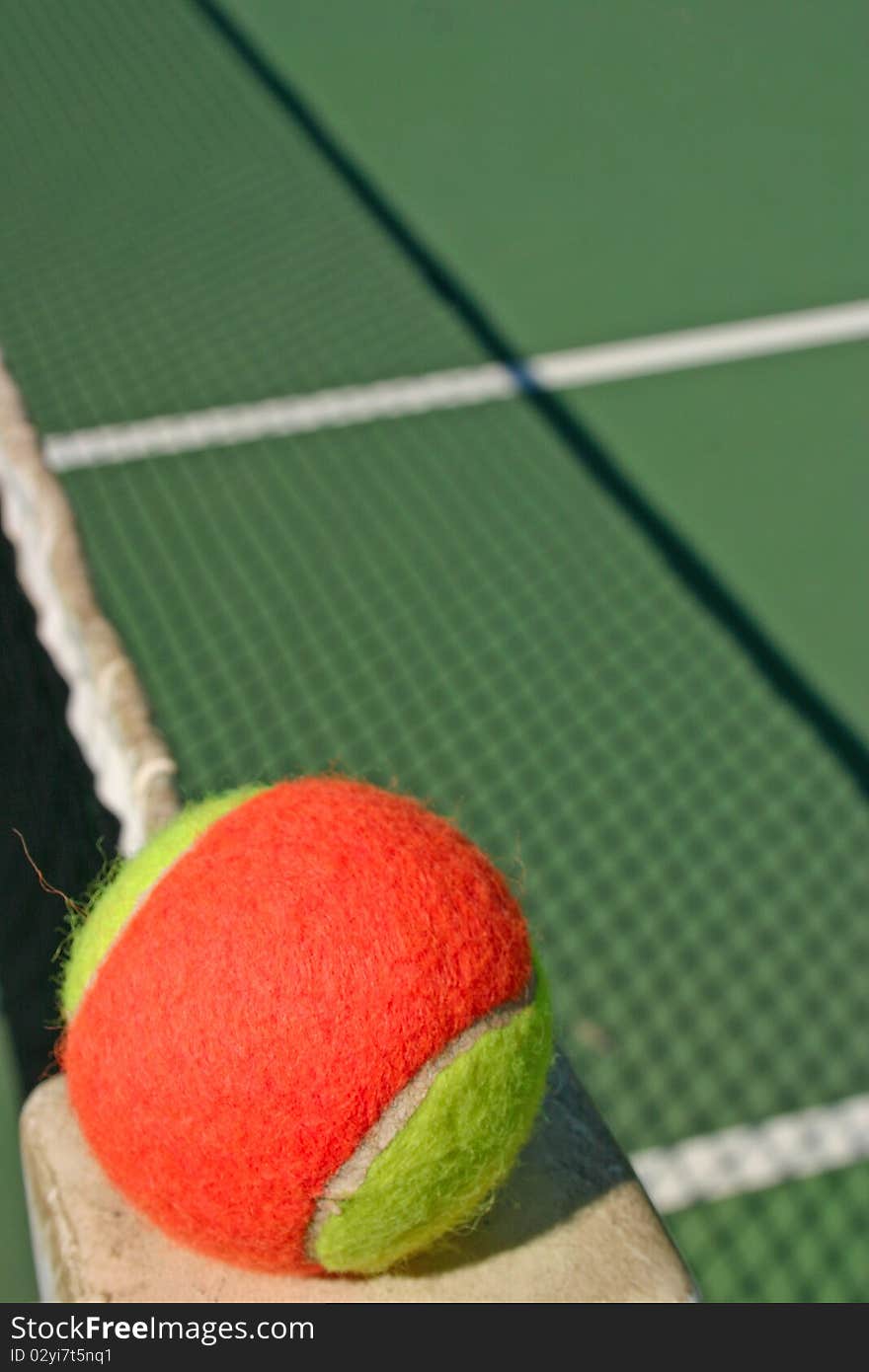 Tennis ball and shadow net