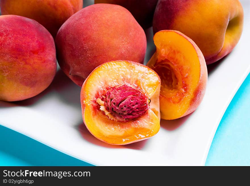 Tasty peaches on a plate. Tasty peaches on a plate