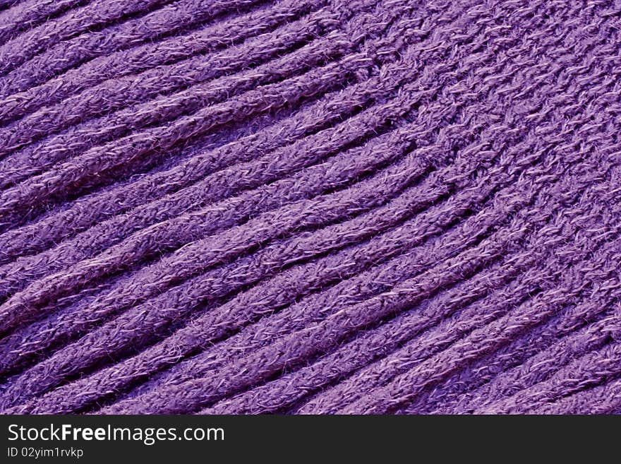 a background of a close up of a knitted scarf fringe. a background of a close up of a knitted scarf fringe