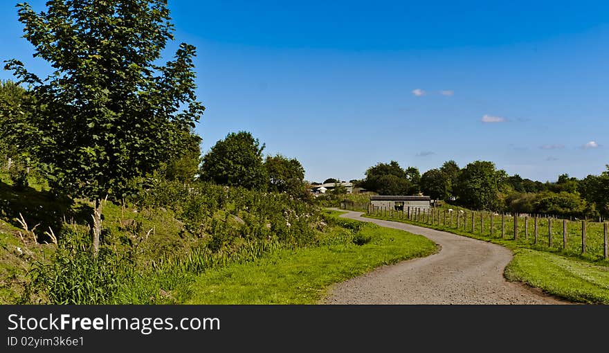 A shot taken of a winding path going through a country field. A shot taken of a winding path going through a country field