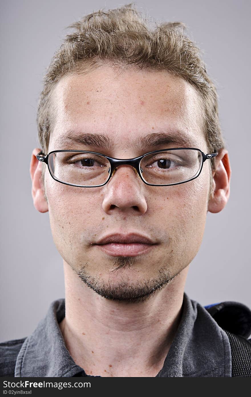 Skinny spectacles man portrait in studio. Skinny spectacles man portrait in studio