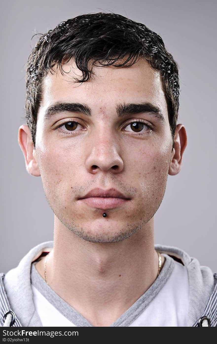 Young man poses for a detailed portrait