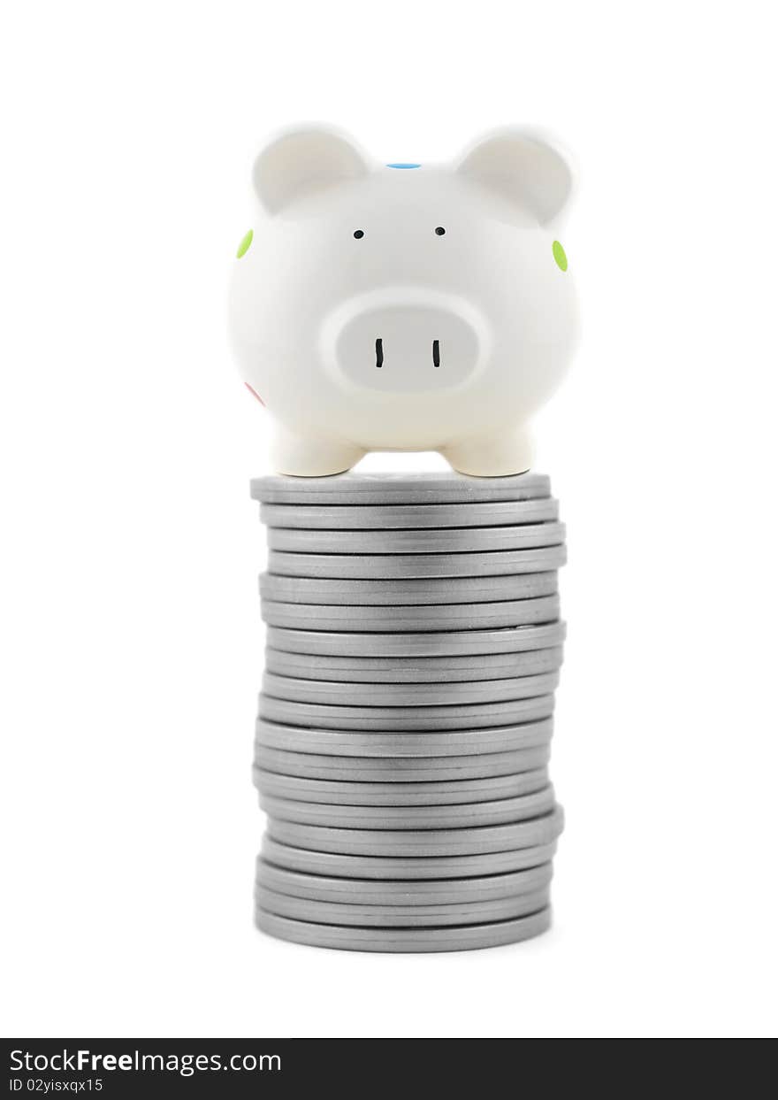 Silver play money with a piggy bank isolated against a white background