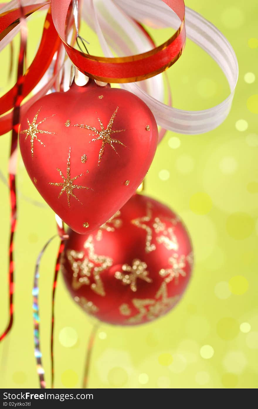 Christmas balls on a green background and abstract bokeh with space