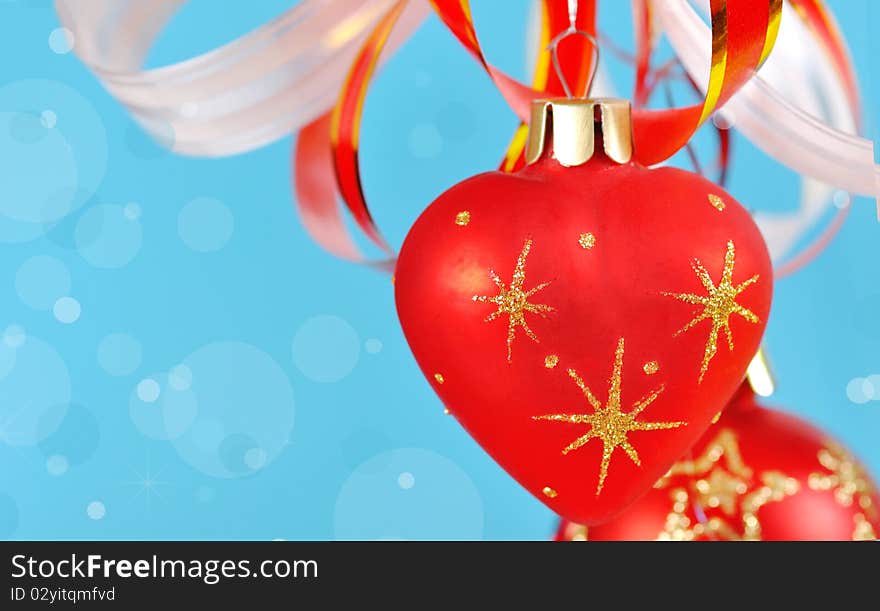 Christmas balls on a blue background and abstract bokeh with  space