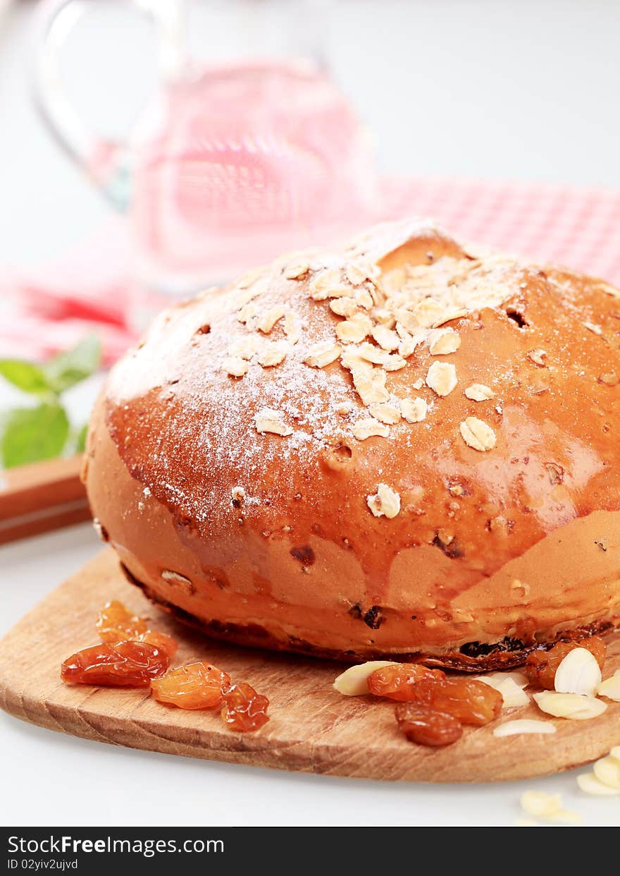 Loaf of sweet bread topped with rolled oats