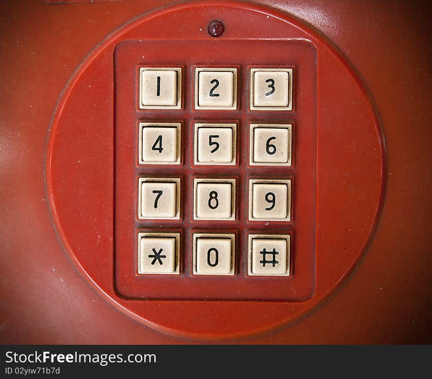 Old white telephone key number on red