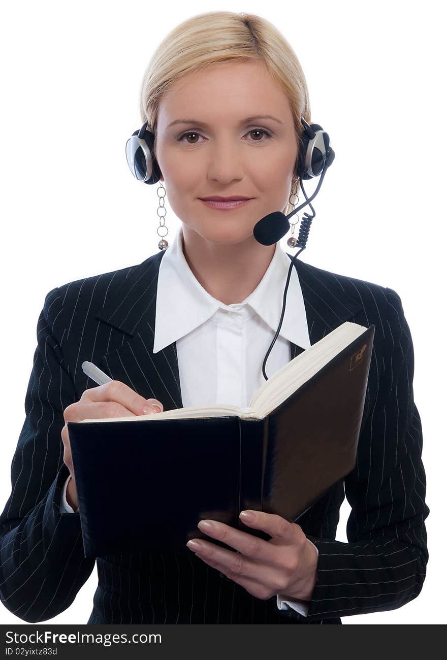 Call center woman with headset and write in a notebook. Call center woman with headset and write in a notebook