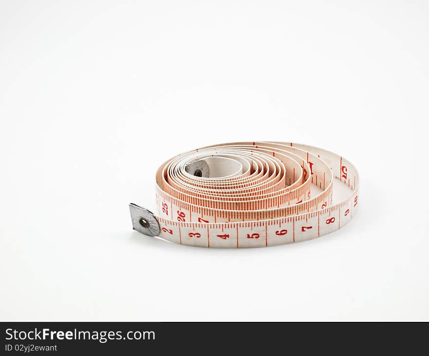 Roll of measuring tape isolated on white background