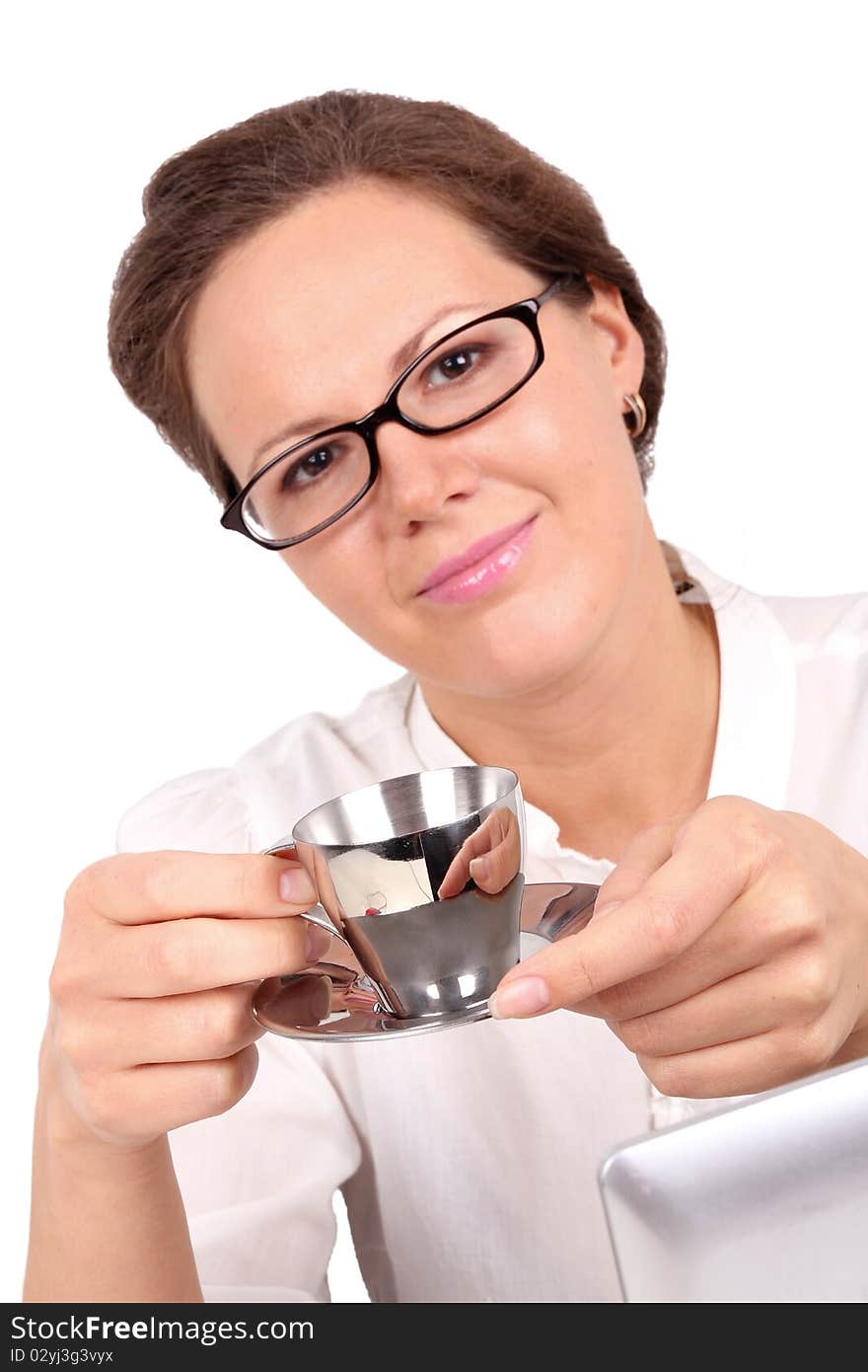 Businesswoman drinking a coffee, focus on hands and cup