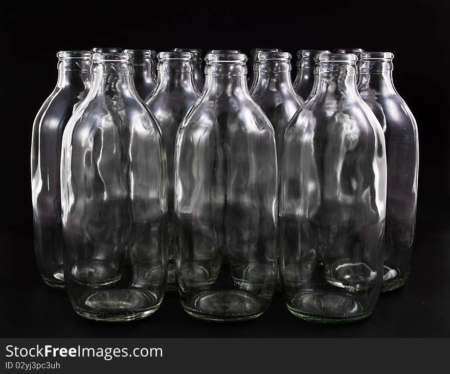 Empty bottles collection, colorless, isolated on black background