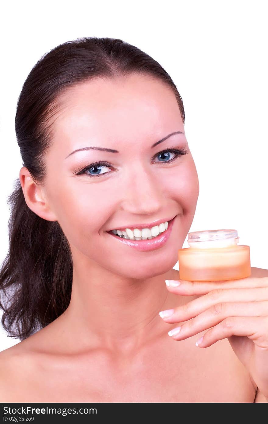 Beautiful woman with box with cream in hand, portrait